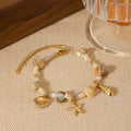Pulseira concha dourada TRIX imagem 1 via fornecedor Trendsi